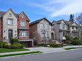 Suburban street with large detached houses