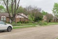 Suburban street with parked car and fallen tree branch near Dallas, Texas, America Royalty Free Stock Photo