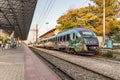 A suburban train parked at platform of the Larissa Train Station