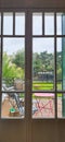 Suburbian garden through window Royalty Free Stock Photo