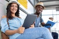 subway passengers reading with modern gadgets as waiting train Royalty Free Stock Photo