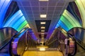 Subway station escalators with colorful walls