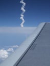 space shuttle contrail above clouds