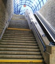 Stairs and escalator exit the subway.