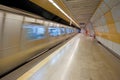 Subway train approaching a platform Royalty Free Stock Photo