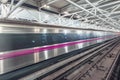 Subway train moves fast through the station interior Royalty Free Stock Photo