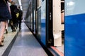Subway train staying on a metro station with doors open with defocused background s Royalty Free Stock Photo