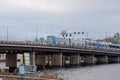 Subway train travels over a bridge over a river Royalty Free Stock Photo