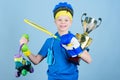 Succeed in everything. Athlete successful boy sport equipment jump rope boxing glove tennis racket roller skate and Royalty Free Stock Photo