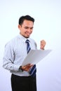 Succesful asian bussinessman, very happy look at the white paper Royalty Free Stock Photo