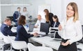 Succesful smiling young business woman in modern office