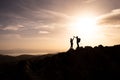 Happy couple man and woman tourist at top of mountain at sunrise a hike in summer Royalty Free Stock Photo