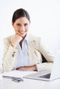 Success is all in a days work. Portrait of a young businesswoman sitting at a desk in an office. Royalty Free Stock Photo