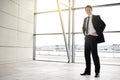 Success breeds confidence. Full length portrait of a businessman standing in the lobby. Royalty Free Stock Photo