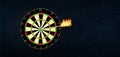 Success and business concept: Dartboard with burning arrow in the bulls eye or the target. Royalty Free Stock Photo