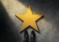 Success in Business or Personal Talent Concept. Top View of Businessman in Shiny Oxford Shoes standing in front of a Golden Star