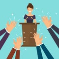 Success in business. Woman giving a speech on stage. Human hands