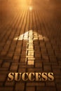 Success concept with arrow. Success word written on road at the sunset Royalty Free Stock Photo