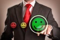 Success concept with businessman pointing out smiley emoticon