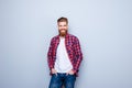 Success concept. Excited young stylish red bearded student in br