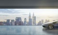 Success concept with night city skyscrapers view from transparent wall in empty presentation hall with luxury sport car. 3D Royalty Free Stock Photo