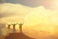 Success concept. Silhouetted of group of people raised hand up in the sky with happy. Royalty Free Stock Photo