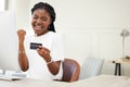 Success, credit card and business woman for online shopping, e commerce and finance, loan or winning bonus. African