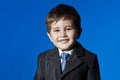 Success, cute little boy portrait over blue chroma background
