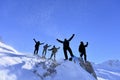 The success of the dynamic group of mountaineers on the stormy summit Royalty Free Stock Photo