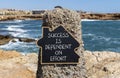 Success and effort symbol. Concept words Success is dependent on effort on beautiful black chalkboard. Beautiful stone sea Royalty Free Stock Photo