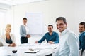 Success is exactly our thing around here. Portrait of a young businessman having a meeting with his colleagues in an Royalty Free Stock Photo