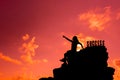 Success and failure concept. Silhouette sporty woman on the cliff.