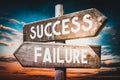 Success, failure - wooden signpost, roadsign with two arrows Royalty Free Stock Photo