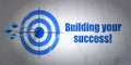 Finance concept: target and Building your Success! on wall background