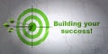 Finance concept: target and Building your Success! on wall background