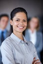 Success happens when you work for it. a confident businesswoman standing in front of her team at the office. Royalty Free Stock Photo