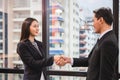 Success and Happiness Team Concept, Businessman and woman handshake finishing up a meeting