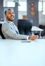 Success has got him smiling broadly. Portrait of a young businessman sitting in an office. Royalty Free Stock Photo