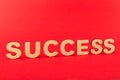 Success inscription on red background