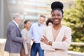 Success isnt new to my team. an attractive young businesswoman standing outside with her arms folded while her Royalty Free Stock Photo