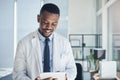 Success is a journey. a young doctor using a digital tablet in an office.