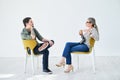 Success is always the main topic of discussion. two businesspeople having a discussion while sitting on chairs in an Royalty Free Stock Photo