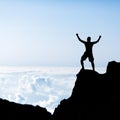 Success man silhouette, climbing in mountains Royalty Free Stock Photo