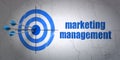 Marketing concept: target and Marketing Management on wall background