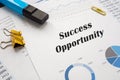 Success Opportunity sign on the piece of paper