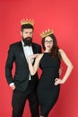 Success is our first name. Business couple celebrate success. Beauty queen and big boss red background. Enjoying success