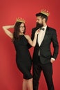 Success is our goal. Happy lovers celebrate success. Couple in love wear crowns red background. Enjoying success. Pride