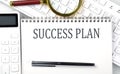 SUCCESS PLAN . Text on notepad with calculator and keyboard,business concept Royalty Free Stock Photo