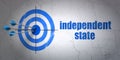 Politics concept: target and Independent State on wall background