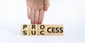 Success process symbol. Businessman turns wooden cubes and changes the word `success` to `process`. Beautiful white background Royalty Free Stock Photo